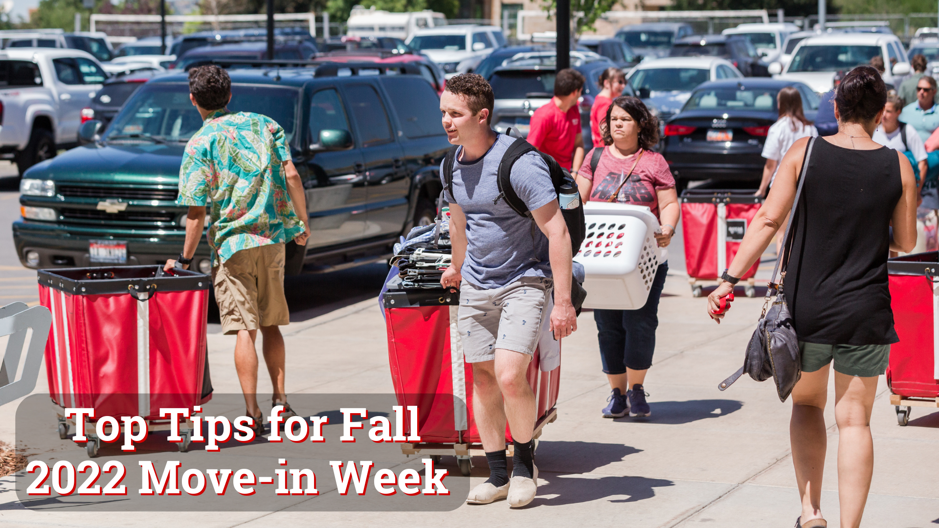 Photo of students moving in and utilizing red carts to carry their items with text that reads "top tips for fall 2022 move-in week."
